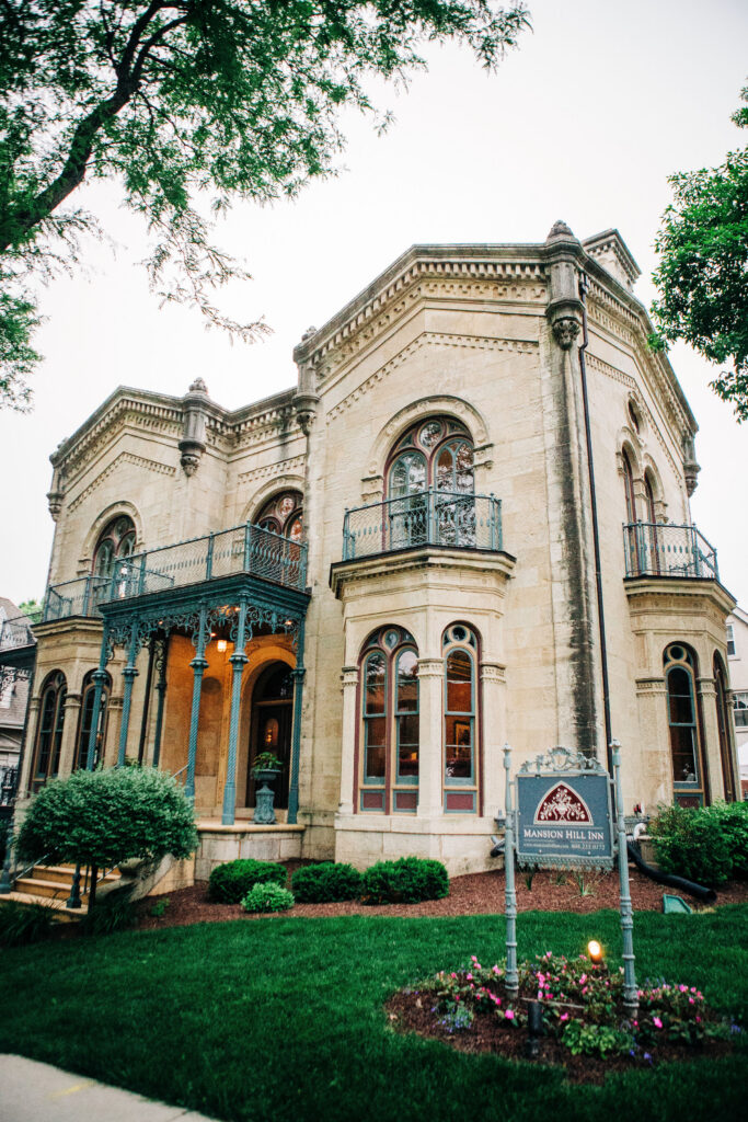 Exterior of Mansion Hill Inn wedding venue in Madison featuring historic architecture and landscaped grounds.