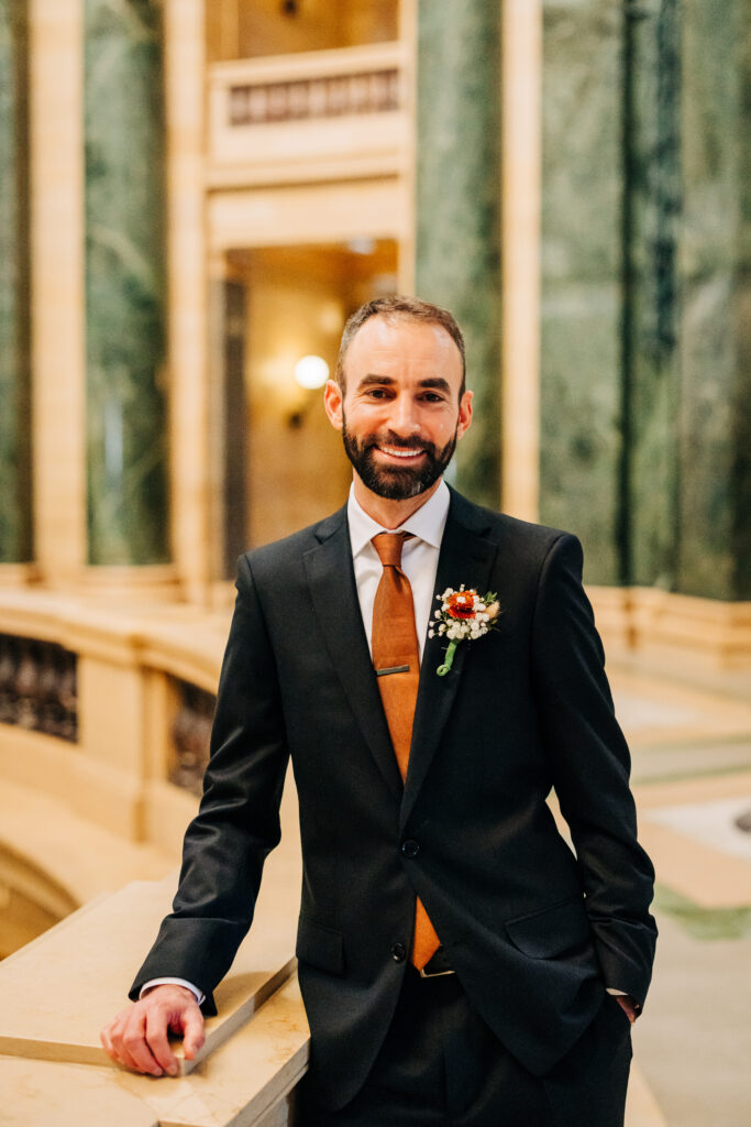 Groom during wedding portraits in Madison, Wisconsin.