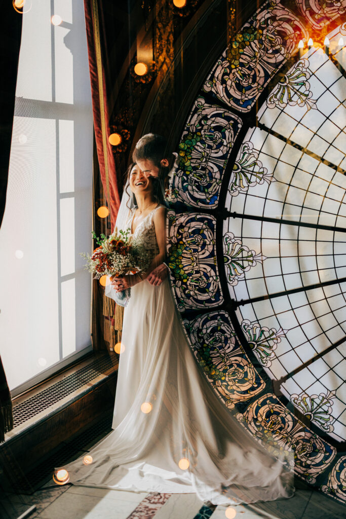 Double-exposure wedding portrait with stained-glass dome overlay at the Wisconsin State Capitol.